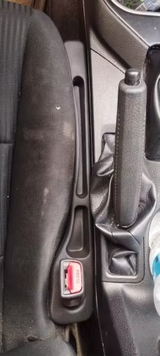 Installed next to handbrake